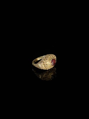 Lot 312 - A GARNET-SET GOLD ‘FLORAL’ PRIEST’S RING