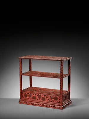 Lot 14 - A FINE CINNABAR LACQUER DISPLAY STAND, QING DYNASTY