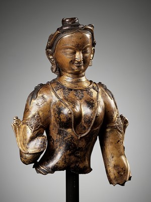 Lot 167 - A LARGE FRAGMENTARY BUST OF A FEMALE DEITY, GILT COPPER-ALLOY, PROBABLY DENSATIL, TIBET, 14TH-15TH CENTURY