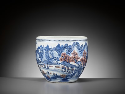 Lot 128 - A MASSIVE COPPER-RED AND UNDERGLAZE-BLUE ‘LANDSCAPE’ FISH BOWL, QING DYNASTY