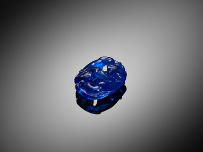 Lot 123 - A BLUE PEKING GLASS ‘BADGERS’ PENDANT, QING DYNASTY