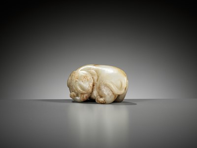 Lot 332 - A CELADON AND RUSSET JADE FIGURE OF AN ELEPHANT, MING DYNASTY