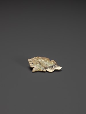 Lot 34 - A TIGER-FORM JADE PENDANT, LATE SHANG DYNASTY