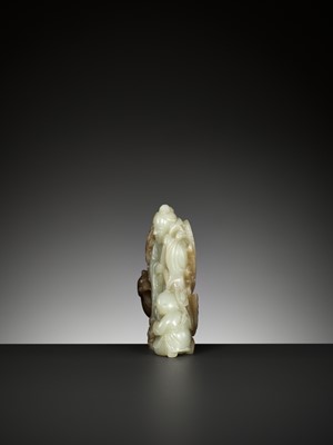 Lot 353 - A CELADON AND BROWN JADE ‘HE XIANGU, BOY AND PHOENIX’ GROUP, QING DYNASTY