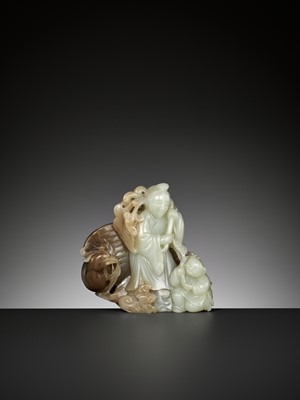Lot 353 - A CELADON AND BROWN JADE ‘HE XIANGU, BOY AND PHOENIX’ GROUP, QING DYNASTY