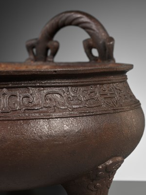 Lot 28 - A LARGE ARCHAISTIC CAST IRON TRIPOD CENSER, MING DYNASTY