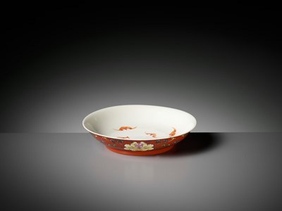 Lot 82 - A FALANGCAI ‘PEONIES AND WUFU’ CORAL-GROUND DISH, QIANLONG MARK AND PERIOD