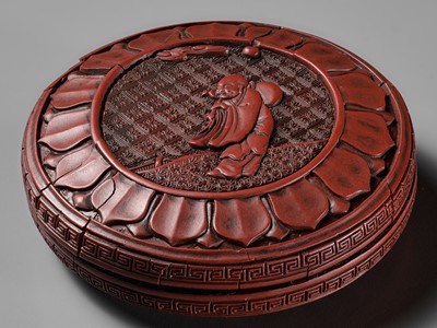 Lot 12 - A CINNABAR LACQUER ‘LUOHAN’ BOX AND COVER, YUAN TO EARLY MING DYNASTY