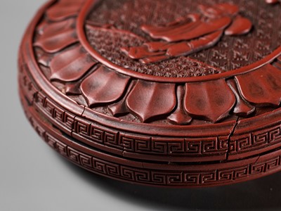 Lot 12 - A CINNABAR LACQUER ‘LUOHAN’ BOX AND COVER, YUAN TO EARLY MING DYNASTY