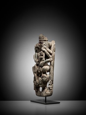 Lot 704 - A GRAY SCHIST RELIEF OF THE JAIN GODDESS AMBIKA WITH HER COMPANION, THE LION