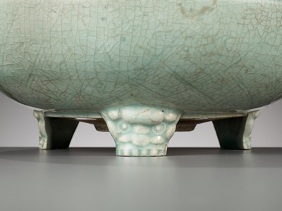Lot 70 - A CARVED AND MOLDED LONGQUAN CELADON TRIPOD CENSER, MING DYNASTY