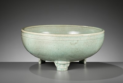 Lot 403 - A CARVED AND MOLDED LONGQUAN CELADON TRIPOD CENSER, MING DYNASTY