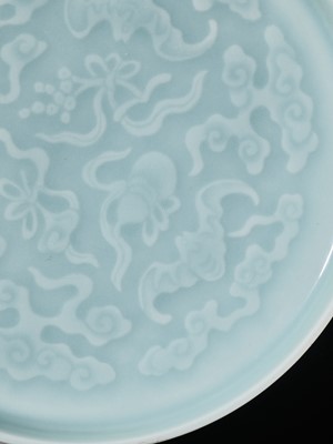 Lot 462 - A CARVED AND CELADON-GLAZED ‘THREE BATS’ DISH, QING DYNASTY