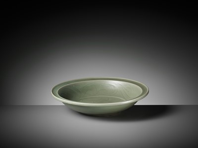 Lot 68 - A CARVED LONGQUAN CELADON ‘LOTUS’ CHARGER, MING DYNASTY