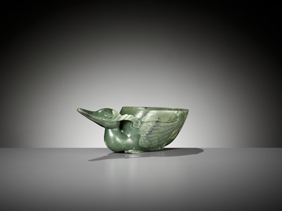 Lot 355 - A SPINACH GREEN JADE ‘DUCK’ LIBATION CUP, QING DYNASTY