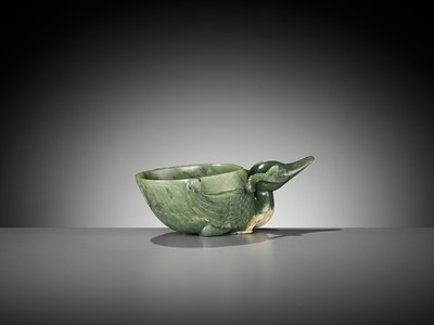 Lot 355 - A SPINACH GREEN JADE ‘DUCK’ LIBATION CUP, QING DYNASTY