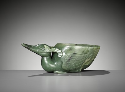 Lot 174 - A SPINACH GREEN JADE ‘DUCK’ LIBATION CUP, QING DYNASTY