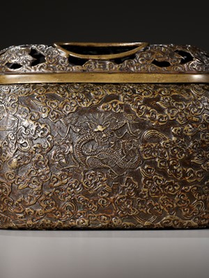 Lot 504 - A BRONZE ‘DRAGON’ HANDWARMER WITH OPENWORK COVER, QING DYNASTY