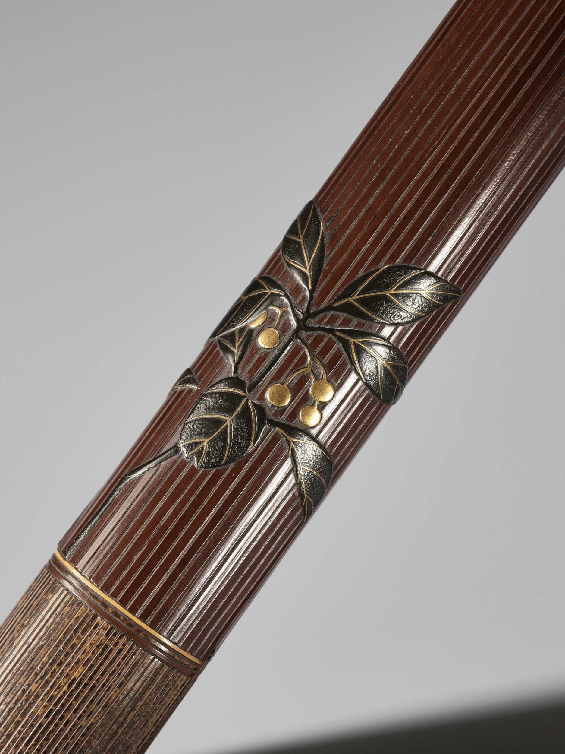 Lot 1605 - TAISAI: A FINE WOVEN RATTAN KISERUZUTSU WITH A LACQUERED DESIGN OF FRUITING YAKUBOJI