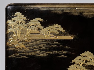 Lot 22 - A BLACK AND GOLD LACQUER SUZURIBAKO WITH A SHORELINE LANDSCAPE AND RED-CRESTED CRANES