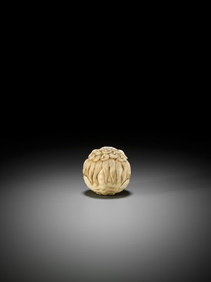 Lot 233 - AN IVORY NETSUKE OF A SHISHI BALL