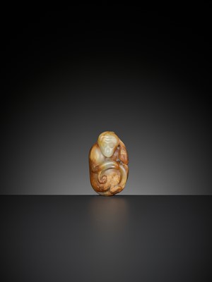 Lot 348 - A PALE CELADON AND RUSSET JADE FIGURE OF A MONKEY, QING DYNASTY