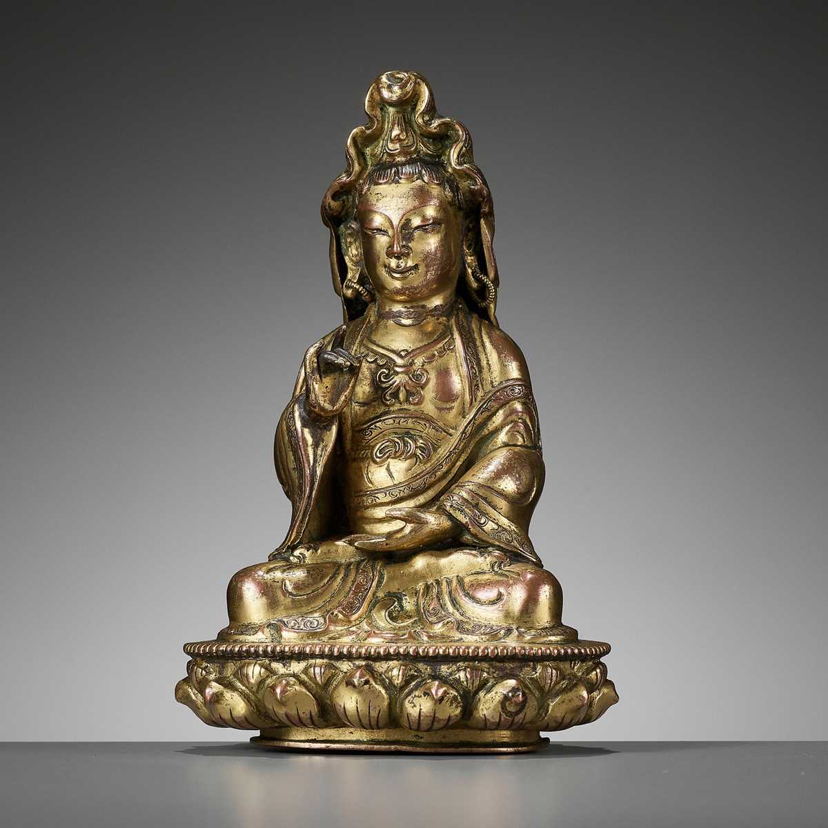 Lot 83 - A GILT COPPER ALLOY FIGURE OF GUANYIN, 18TH CENTURY