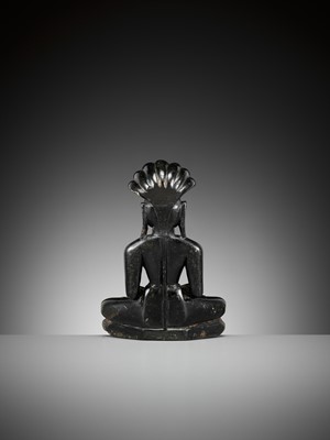 A BLACK STONE FIGURE OF PARSHVANATHA, JAIN, 15TH-17TH CENTURY