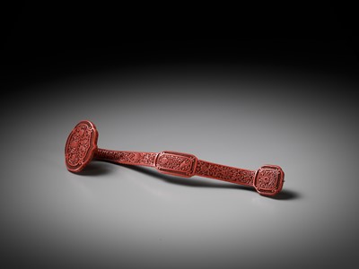 Lot 11 - A CARVED CINNABAR LACQUER ‘BAJIXIANG’ RUYI SCEPTER, QING DYNASTY