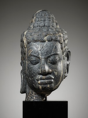 Lot 230 - A MONUMENTAL STONE HEAD OF BUDDHA, MON-DVARAVATI PERIOD
