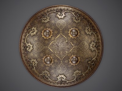 Lot 712 - A MUGHAL STYLE IRON CEREMONIAL SHIELD, 17TH-18TH CENTURY
