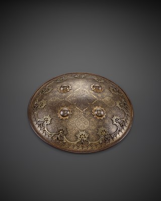 Lot 712 - A MUGHAL STYLE IRON CEREMONIAL SHIELD, 17TH-18TH CENTURY