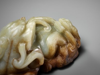 Lot 43 - A CELADON AND RUSSET JADE ‘BUDDHIST LION AND CUB’ GROUP, 17TH CENTURY