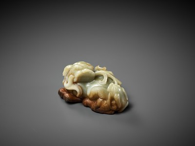 Lot 43 - A CELADON AND RUSSET JADE ‘BUDDHIST LION AND CUB’ GROUP, 17TH CENTURY