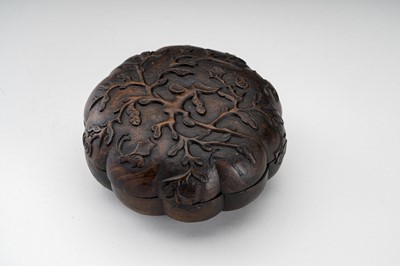 Lot 33 - A MELON-SHAPED CARVED WOODEN BOX, QING