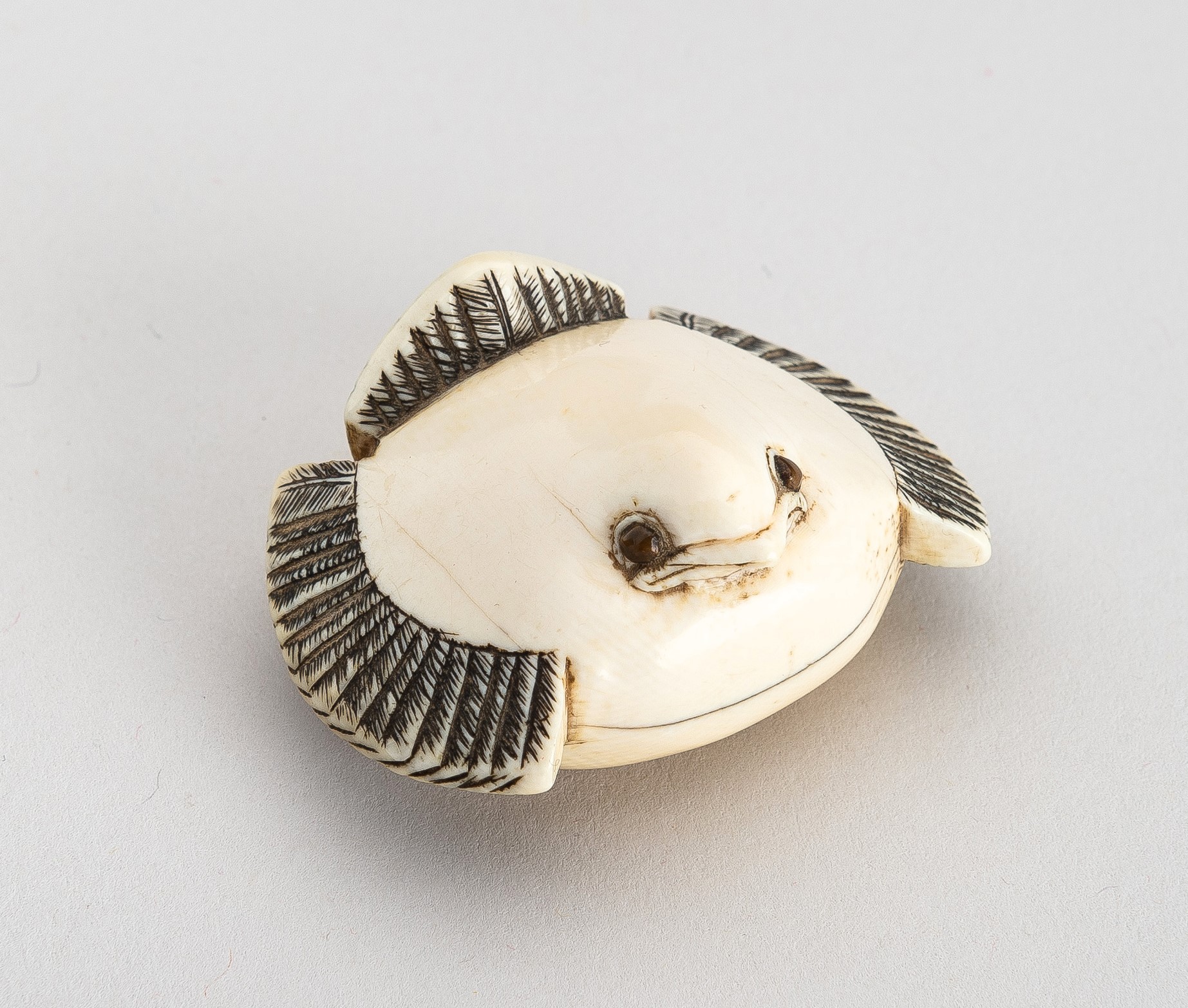 Lot 1382 - OKATOMO: AN IVORY NETSUKE OF THE FUKURA