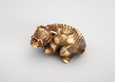 Lot 1541 - A STAG ANTLER NETSUKE OF RECUMBENT OX