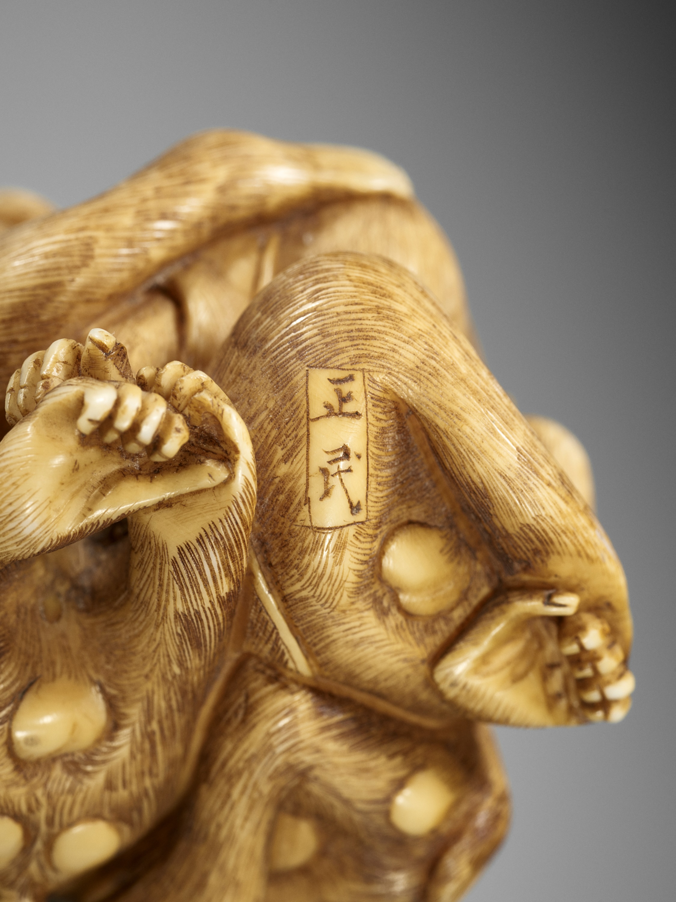 Lot 139 - MASATAMI: A RARE IVORY NETSUKE OF THE