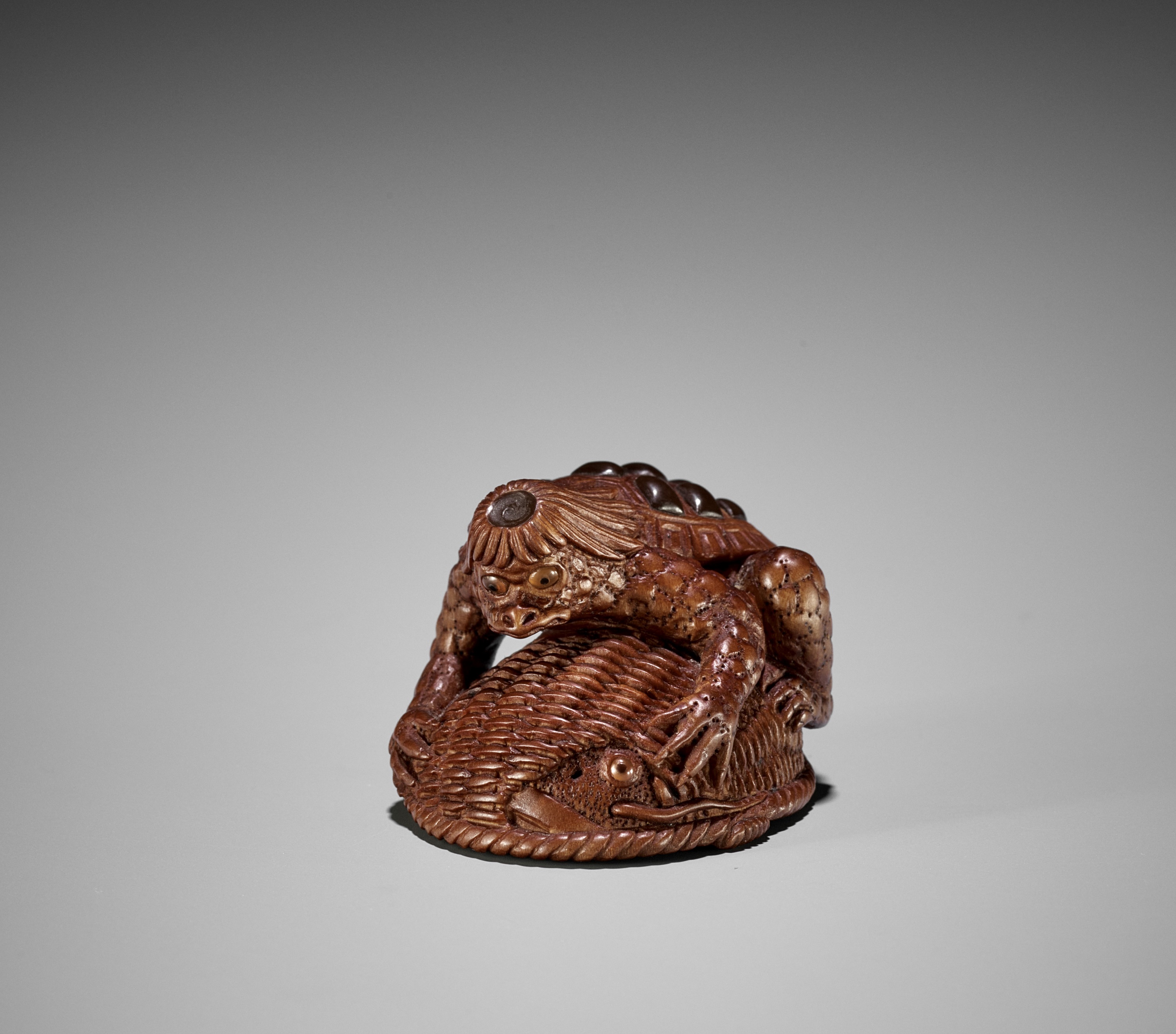 Ɏ AKIHIDE: A FINE CONTEMPORARY INLAID WOOD NETSUKE OF A KAPPA TRAPPING A  NAMAZU