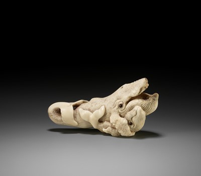 Lot 161 - BISHU: A LARGE BONE NETSUKE OF A WHALE WITH YOUNG
