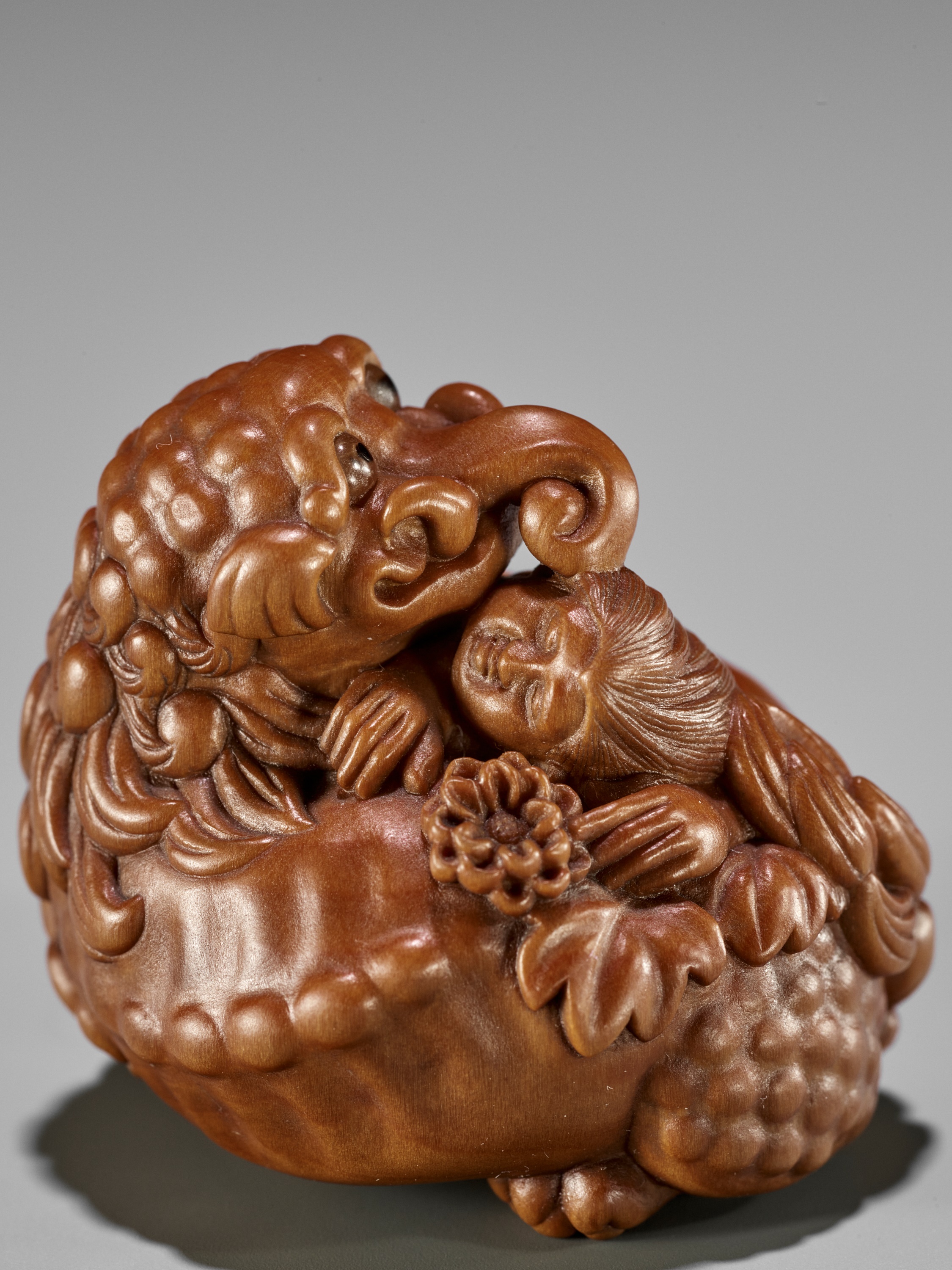 Lot 152 - HIDEYUKI: A SUPERB WOOD NETSUKE OF KIKUJIDO