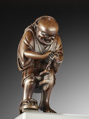 Lot 247 - A WOOD NETSUKE OF THE OIL THIEF, ATTRIBUTED TO MASAYOSHI