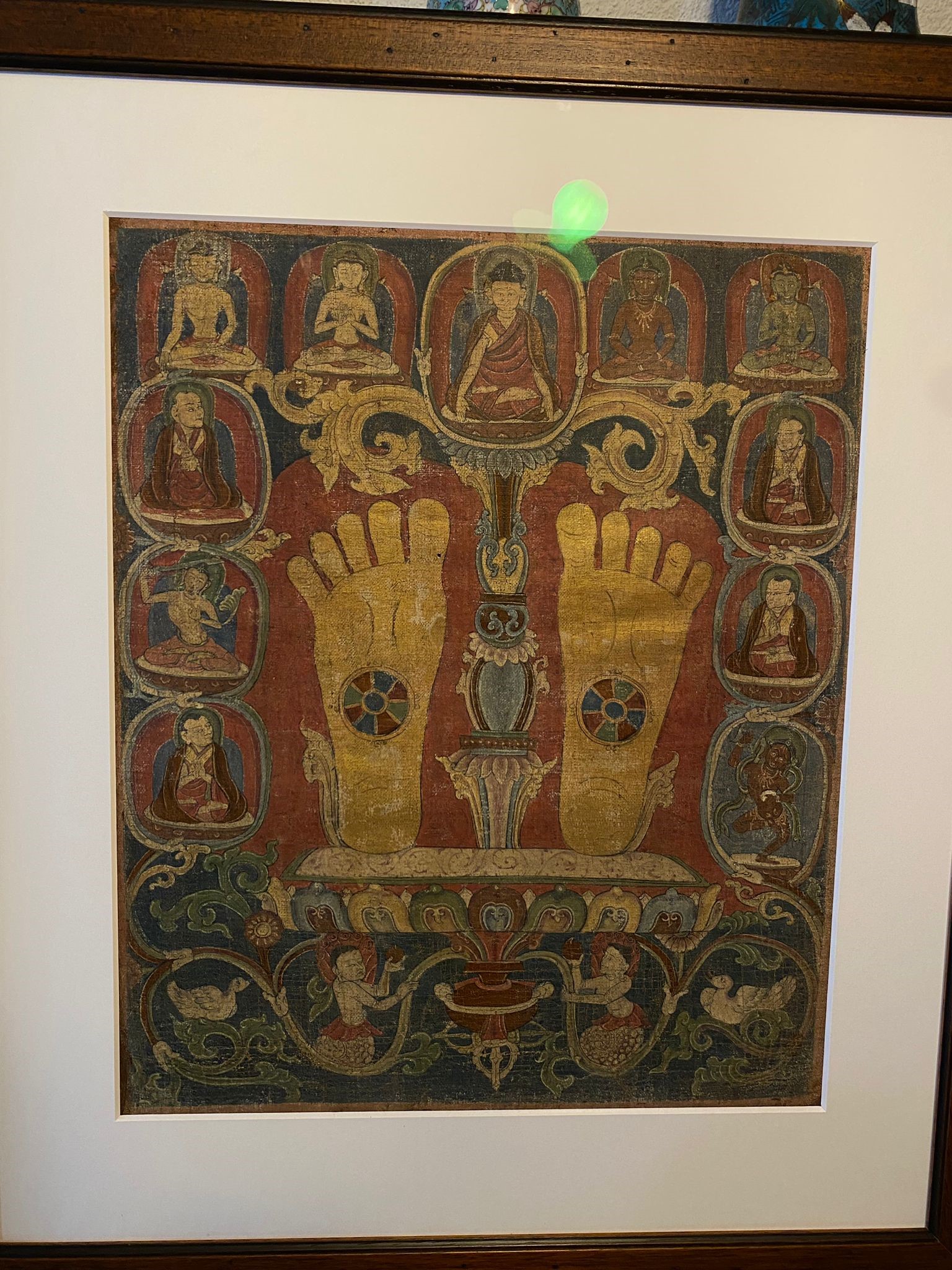 Lot 184 - A RARE THANGKA WITH THE FOOTPRINTS OF A