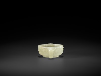 Lot 329 - A PALE CELADON TWO-HANDLED JADE CUP, MING DYNASTY