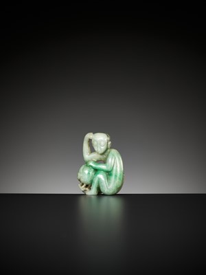 Lot 365 - A JADEITE PENDANT OF A MONKEY WITH PEACH, LATE QING TO REPUBLIC