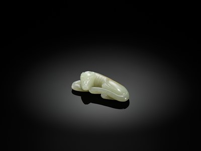 Lot 139 - A PALE CELADON JADE CARVING OF A DOG, QING