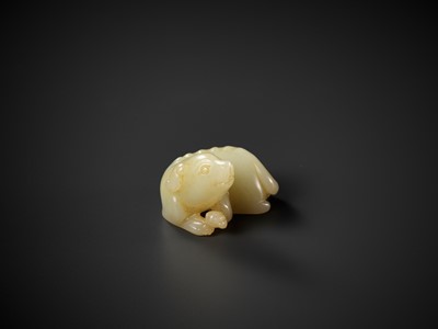 Lot 339 - A YELLOW JADE FIGURE OF A DOG, QING DYNASTY