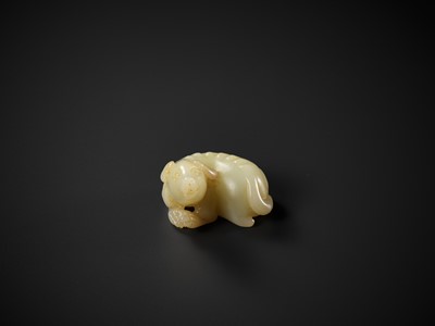 Lot 339 - A YELLOW JADE FIGURE OF A DOG, QING DYNASTY