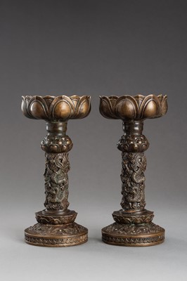 Lot 254 - A PAIR OF ARCHAISTIC BRONZE CANDLE HOLDERS, 1900s