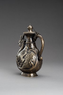 Lot 255 - AN ARCHAISTIC ‘PHOENIX AND DRAGON’ METAL EWER, 1920s